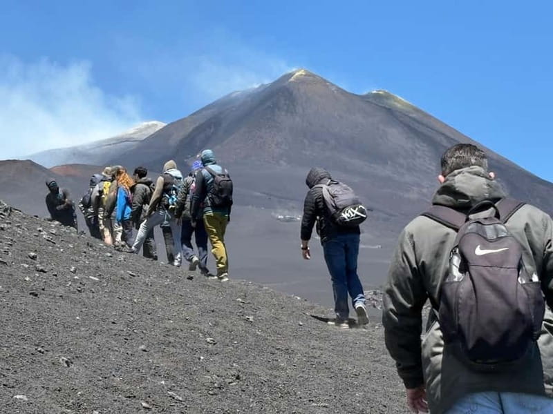 Catania: Mount Etna Adventurous Hiking Tour with Equipment - A lava tube and a fast, dusty descent