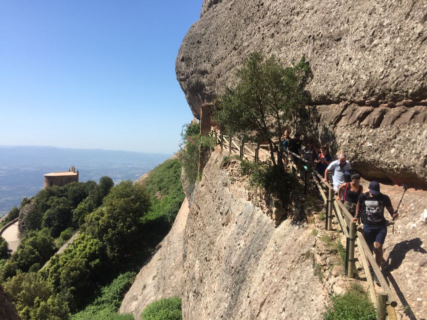 From Barcelona: Montserrat Mountain Hike and Abbey Tour - Riding the Sant Joan funicular to the high paths
