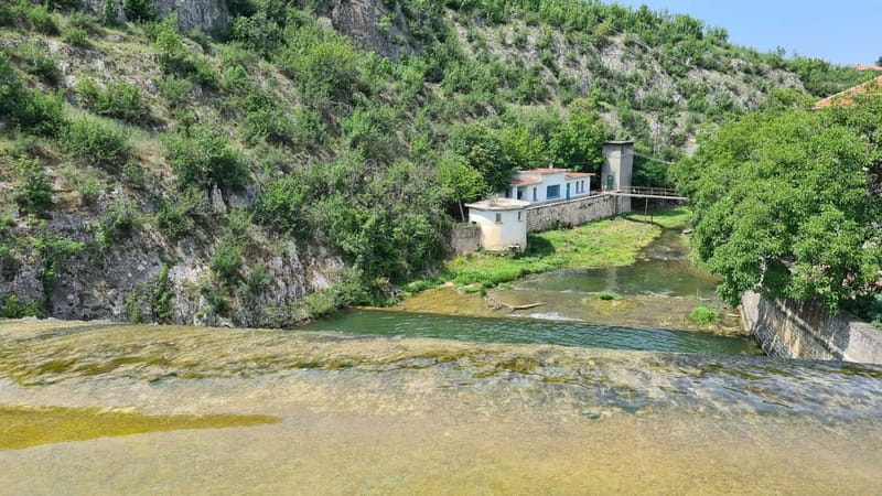 From Sofia: Zlatna Panega River Hike with Springs Visit - Entering the Zlatna Panega spring through the cave