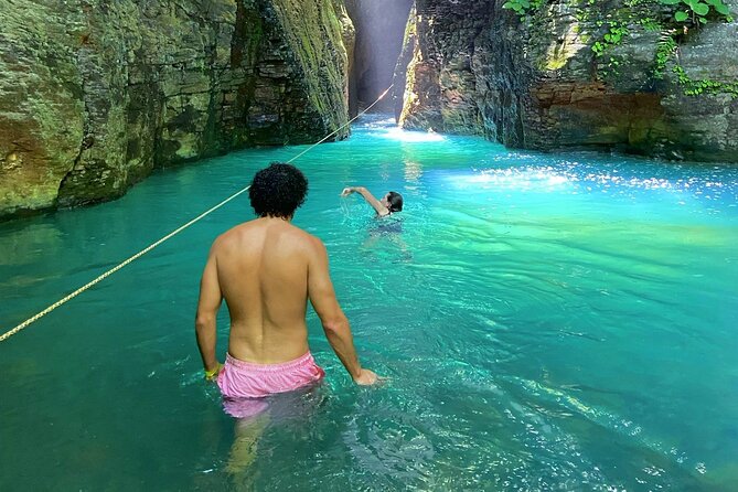 La Leona waterfall adventure hike half day - River crossings, caves, and route choices