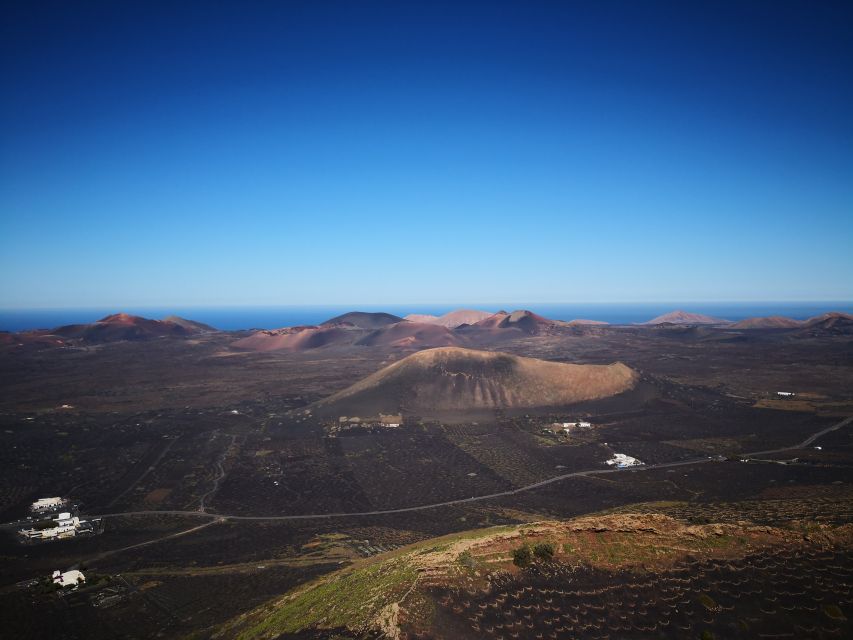 Lanzarote: La Geria Vineyards Hiking Tour - Walking through black ash and working vineyards