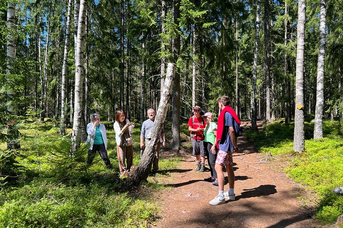 National Park Hike & Finnish Smoke Sauna Experience with Campfire Lunch - Smoke sauna, towel, and cold lake